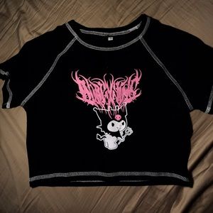 Small black crop top with cutesy print on it:D.